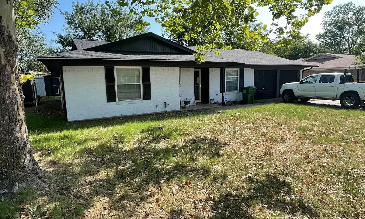 Professional roofing crew working on a residential roof in East Lampeter
